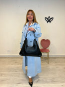 Bolso polipiel media luna con tachuelas negro