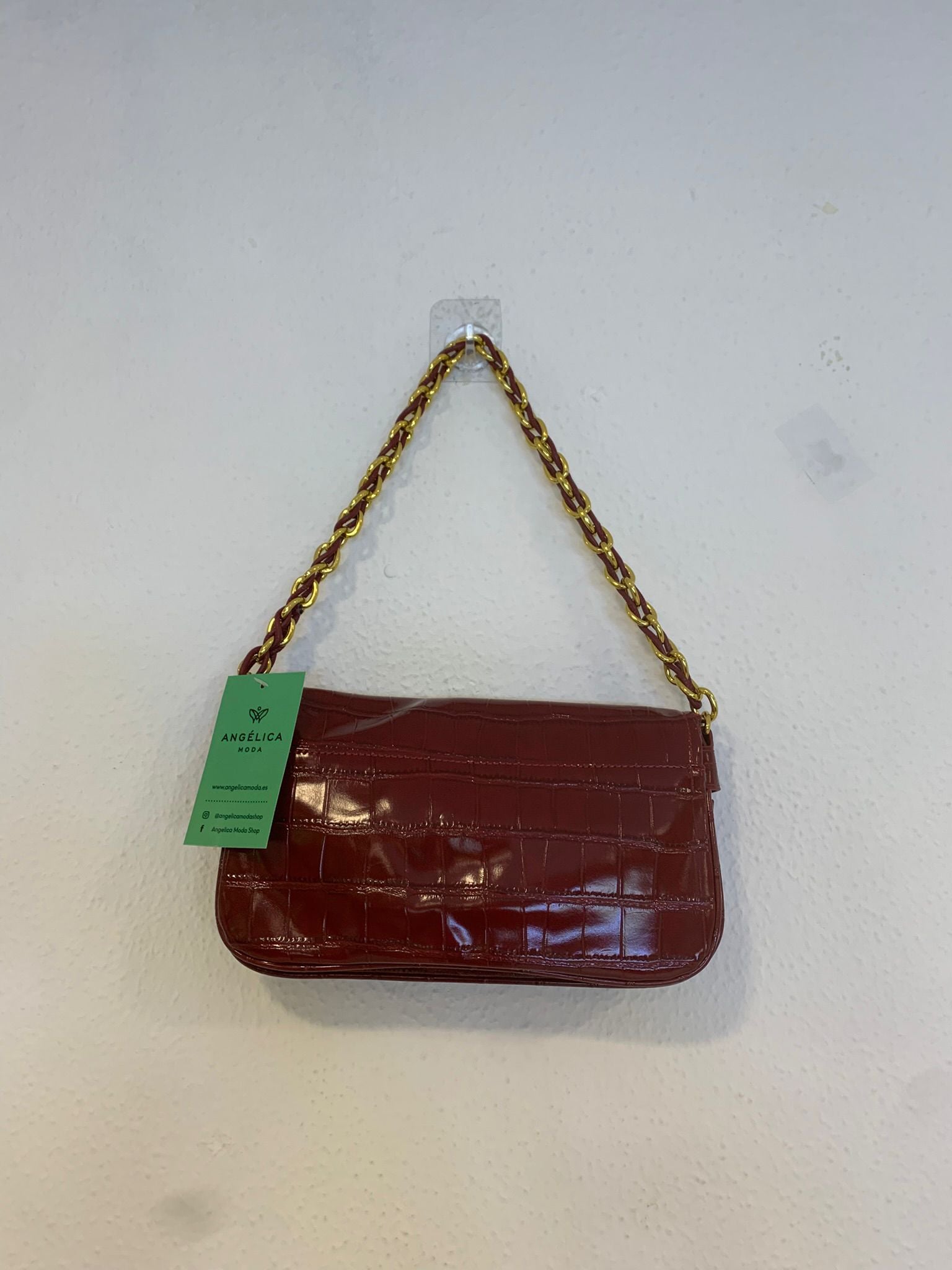 Bolso cartera alargado polipiel brillo asa doradas burdeos