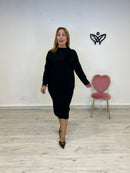 Conjunto de punto de falda con abertura y goma y jersey negro