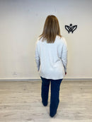 Jersey de punto largo de cuello subido beis