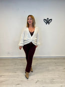 Jersey de punto escote en pico con nudo beis