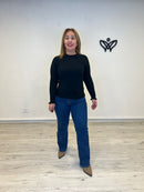 Jersey de punto cuello redondo con volantes discreto en negro