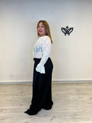 Pantalón largo de pinzas con bolsillos recto negro