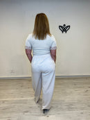 Pantalón beige de mujer con pinzas y bolsillos