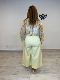 Pantalón midi bolsillos amarillo