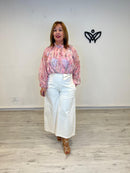 Pantalón midi beige con bolsillos