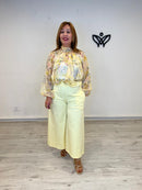 Pantalón midi bolsillos amarillo