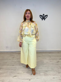 Pantalón midi bolsillos amarillo