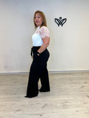 Mono blanco y negro palazzo con encaje elegante