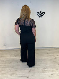 Mono negro palazzo con encaje elegante