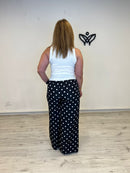 Pantalón palazzo negro con lunares blancos satinado
