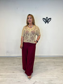 Jersey de crochet dorado con escote de pico