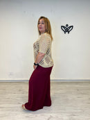 Jersey de crochet dorado con escote de pico
