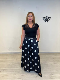 Pantalón satinado negro con lunares corte palazzo