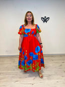 Vestido largo estampado con mangas abullonadas y escote nido de abeja