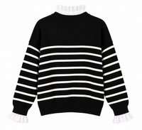 Jersey de rayas negras y blancas con efecto camisa y botones dorados