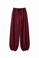 Pantalón burdeos satinado de estilo bombacho con cintura elástica