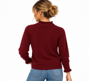 Jersey burdeos de mujer con volantes en cuello y puños