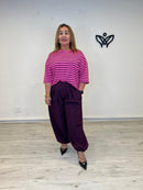 Pantalón bombacho burdeos con pinzas y cintura elástica